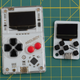 The Arduboy Mini sitting next to the original Arduboy.